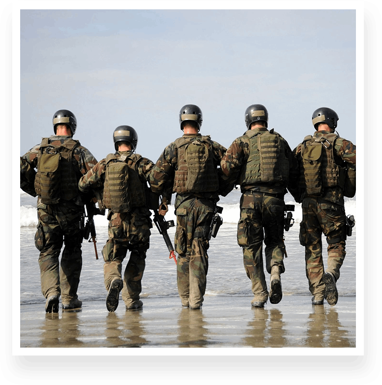 Portrait of an army team walking into the sea